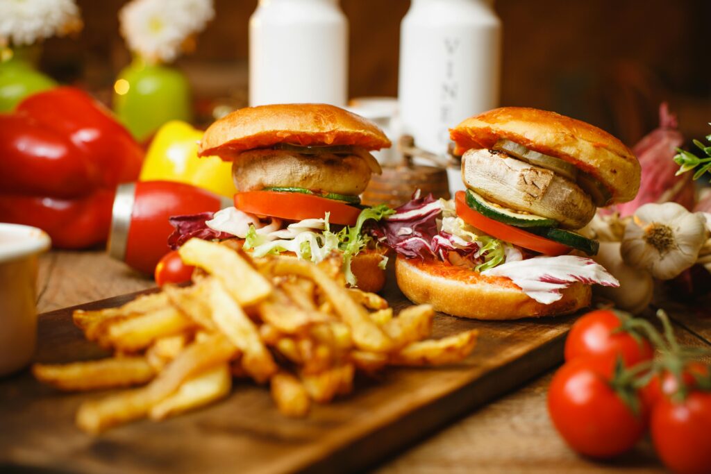 Delicious vegetarian burgers with fresh vegetables and crispy fries, perfect for a tasty meal.